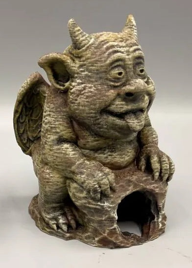 Piece 2: round right gargoyle — exact crop from original licensed photo