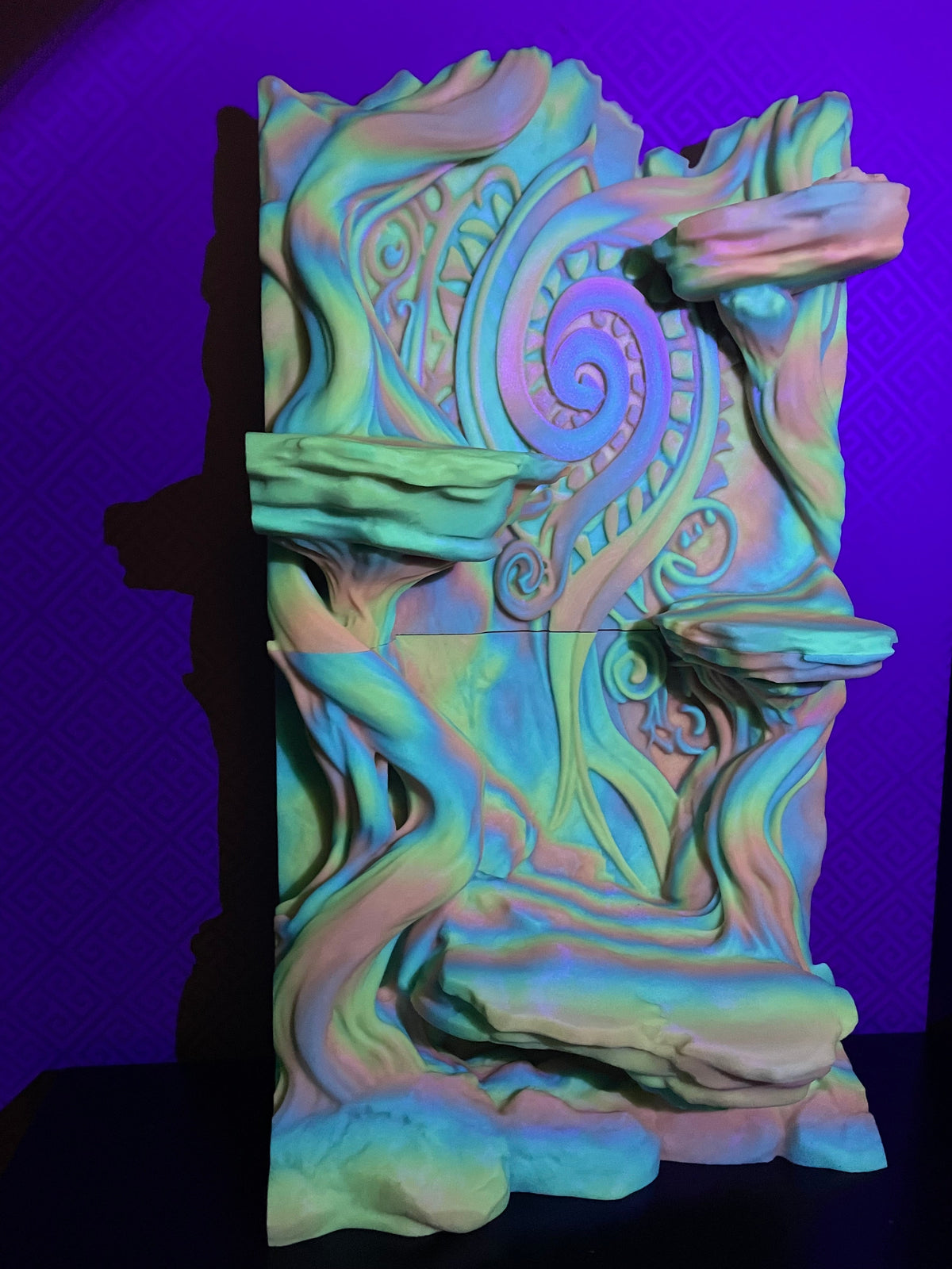 Maori-Inspired 3D Background photographed under coloured lighting