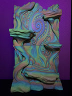 Maori-Inspired 3D Background under coloured lighting, showing the central spiral relief