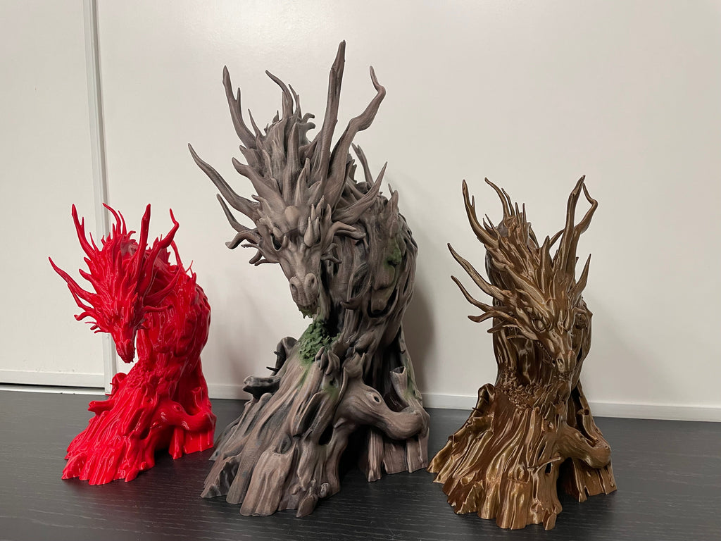 Three Driftwood Dragons printed in different colours, alternate view