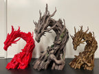 Three Driftwood Dragons printed in different colours side by side