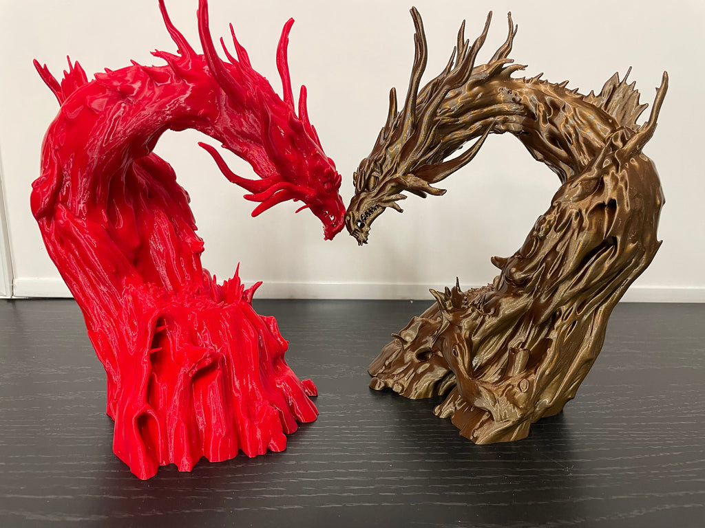 Driftwood Dragon printed in red beside one printed in a driftwood colour