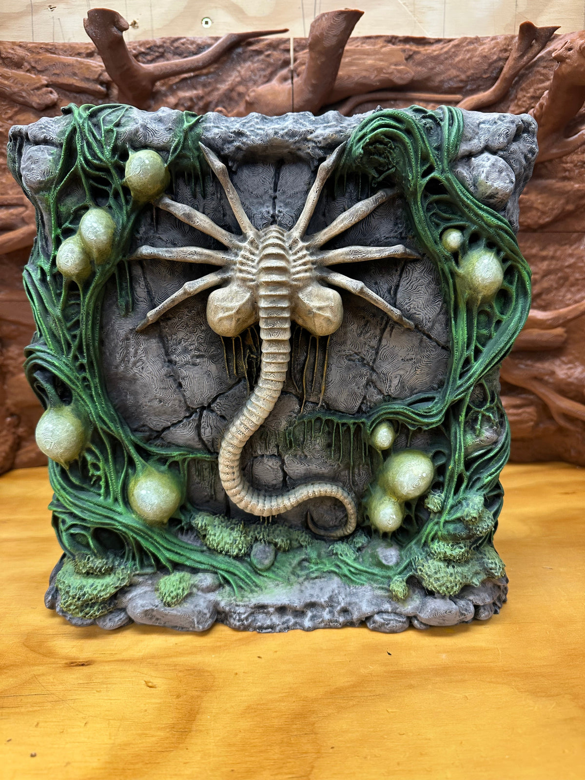 Hand-painted Facehugger 3D Background, finished in green and stone tones