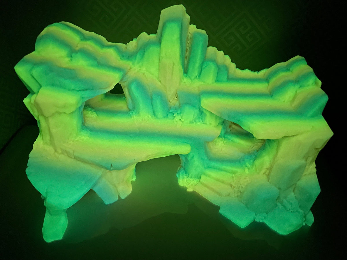 Stone Step Hideaway glowing in the dark, showing the ledges and openings