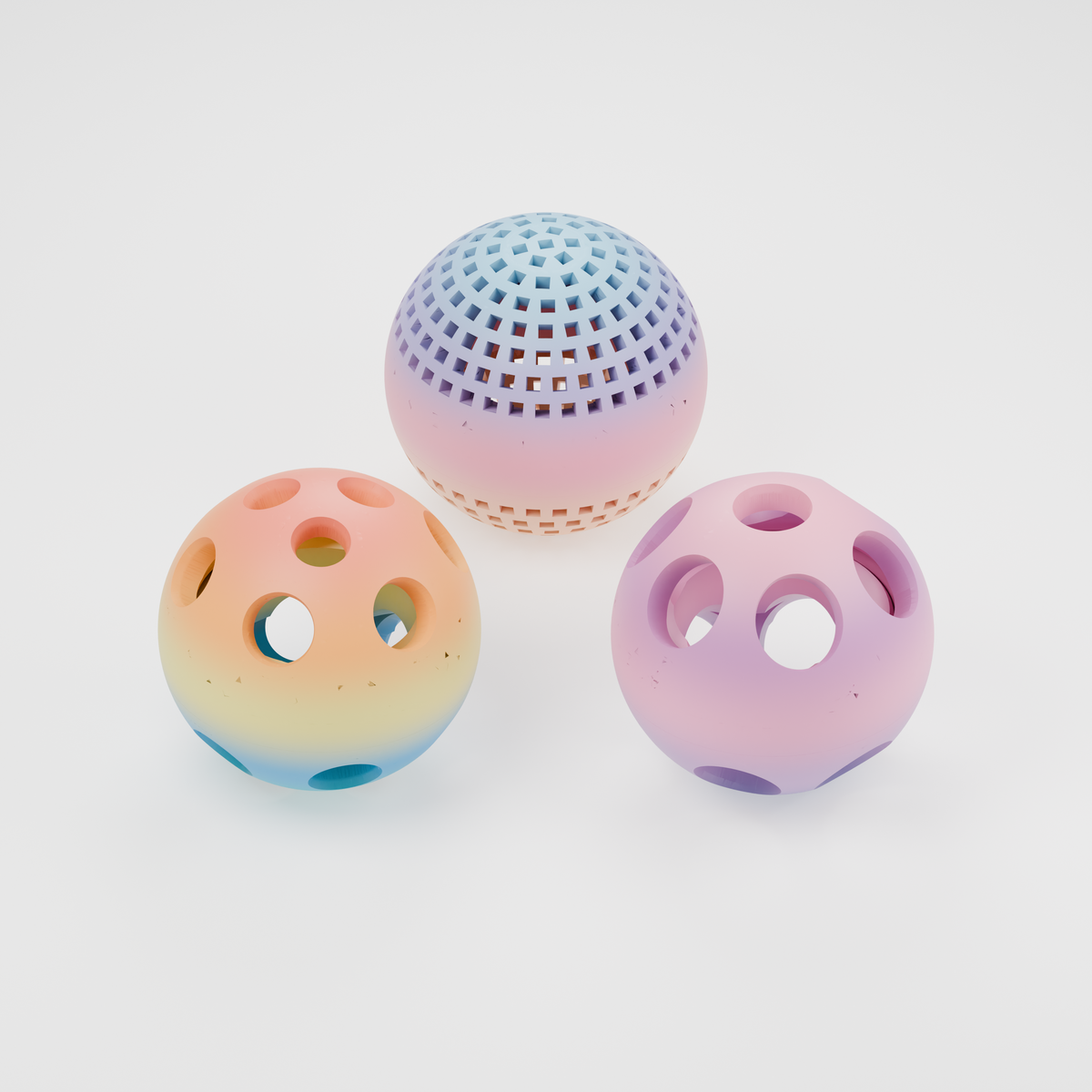 Three PawQuest prey balls from production V14: Ringed treat-opening ball in Paint Splash at left, Mosaic treat-opening ball in Dreamy Dusk at right, and ventilated Mesh ball in Vibrant Coral behind. Multicolour PLA; colour transitions vary by print. No glow filament.