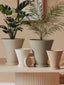 Scandi rippled flower pots with trays in a styled interior
